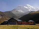 Ecuador Chimborazo 05-04 Estrella del Chimborazo Main Building In The Morning With Chimborazo Behind Perfectly situated at the foot of Chimborazo is the mountain lodge Estrella del Chimborazo (4000m, also called Chimborazo Hill Star or Chimborazo Base Camp). Here is a view of the main lodge with Chimborazo basking in the early morning sun.